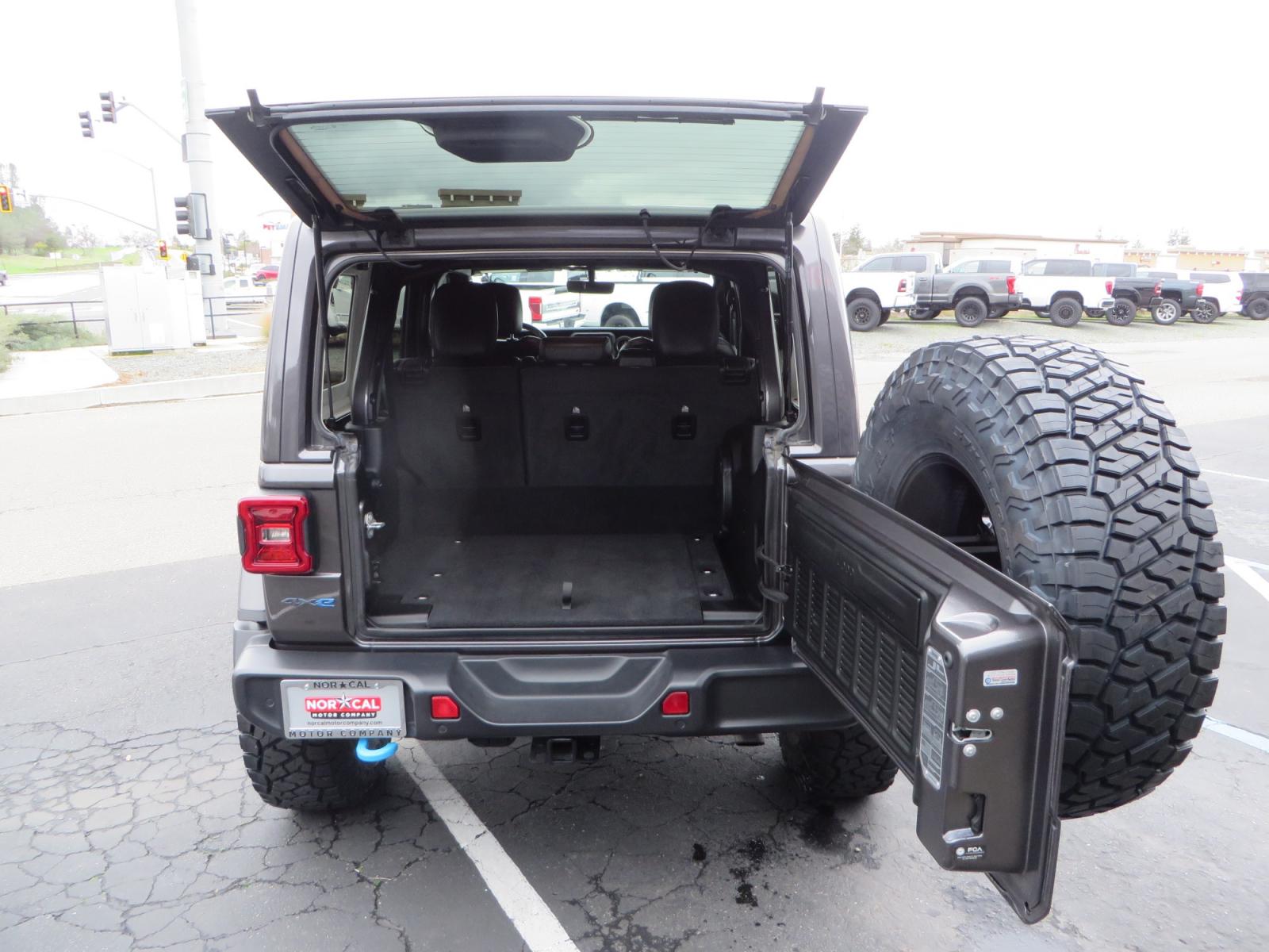 2021 CHARCOAL /BLACK Jeep Wrangler Unlimited Rubicon 4XE 4d SUV 4wd (1C4JJXR60MW) with an 2.0L L4 DOHC 16V TURBO engine, automatic transmission, located at 2630 Grass Valley Highway, Auburn, CA, 95603, (530) 508-5100, 38.937893, -121.095482 - 4XE Rubicon sitting on a Zone offroad suspension system, Fox shocks, 37" Toyo RT trail tires, 17" Method Race wheels, Teraflex Hd tire carrier, and Flat tow ready. - Photo #59